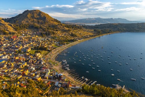 Cityscape of Copacabana city and the Titicaca Lake at sunset, Bolivia.